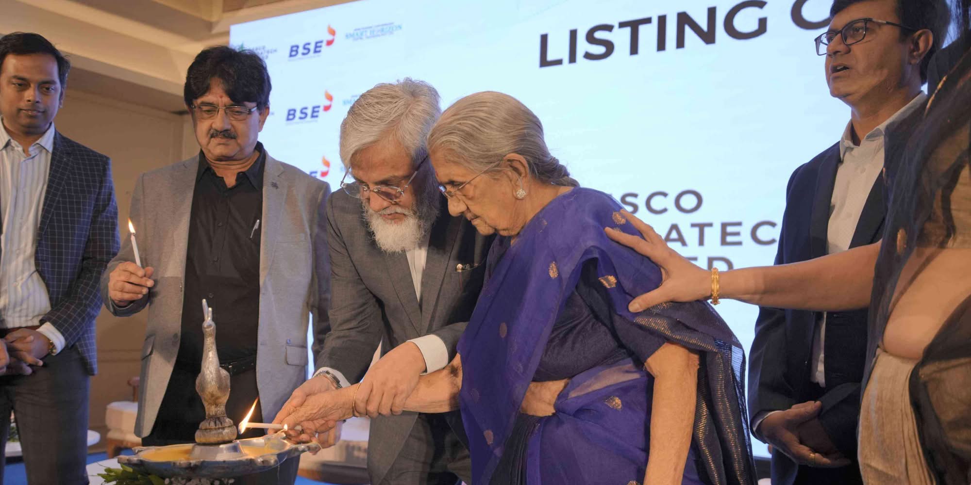 Lighting candle ceremony for Desco Infratech Limited corporate milestone.